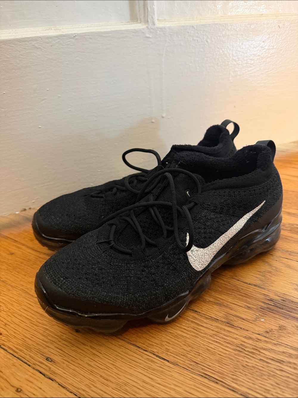 Nike Women’s Black Knit Sneakers with White Swoosh